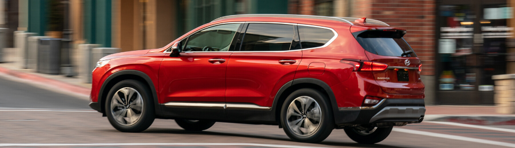 Red 2020 Hyundai Santa Fe driving