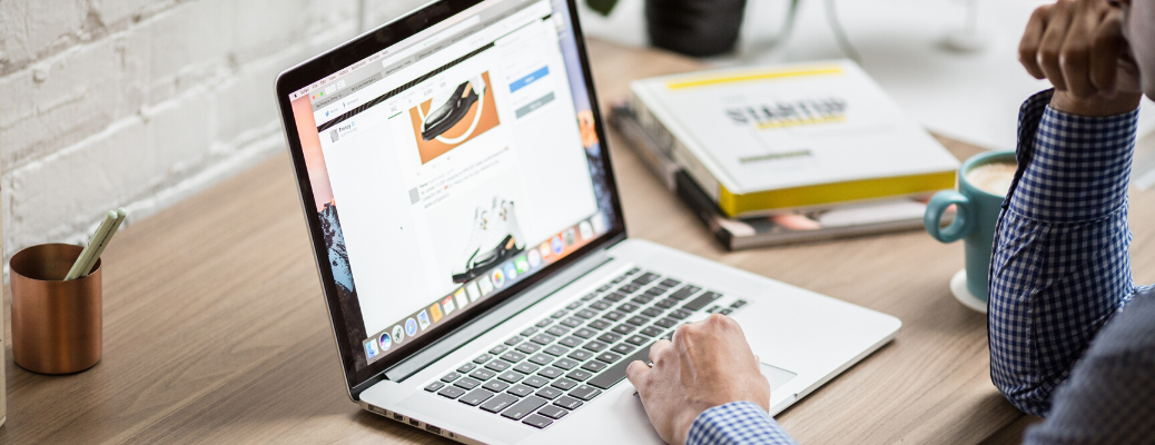 Person searching for cars on laptop