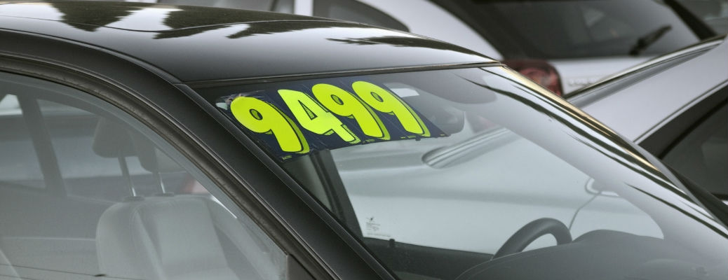 Price sticker on vehicle window