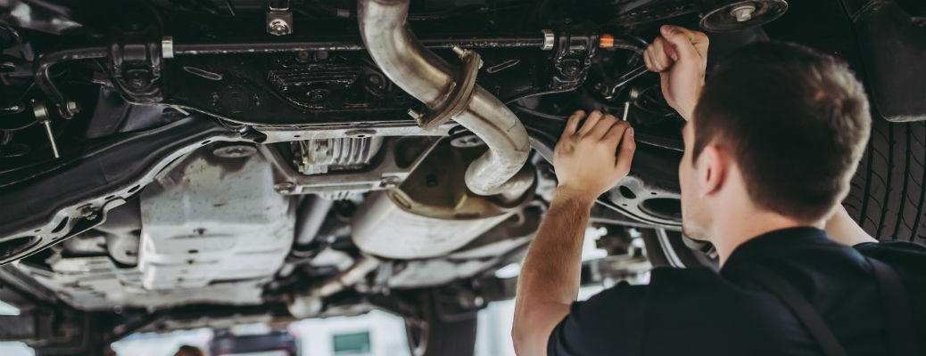 Mechanic working under vehicle