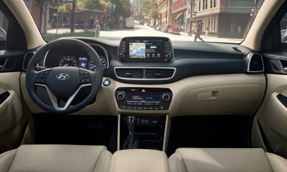 Voice command button circled in blue in 2021 Hyundai Tucson