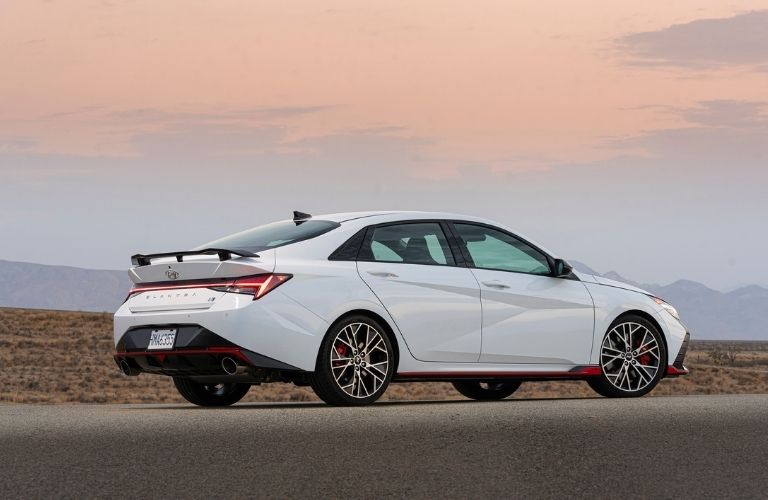 White 2022 Hyundai Elantra N Rear Exterior on a Desert Road